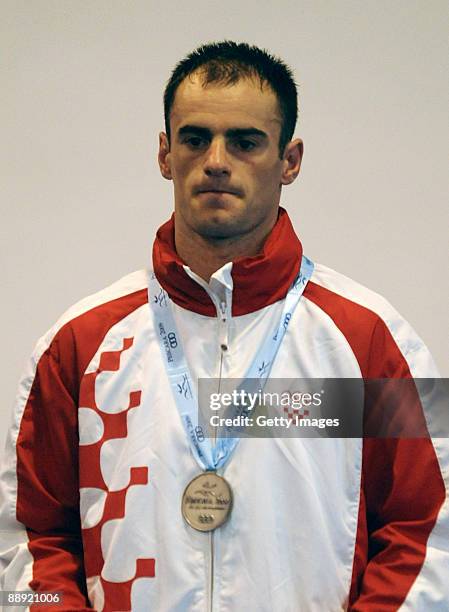 Silver medalist Filip Palic of Croatia stands on the podium during the medal ceremony Men's Light 60kg final on day 6 during the XVI Mediterranean...