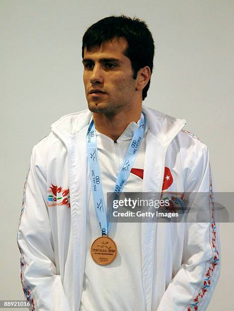 Bronze medalist Yakup Kilic of Turkey stands on the podium during the medal ceremony Men's Light 60kg final on day 6 during the XVI Mediterranean...