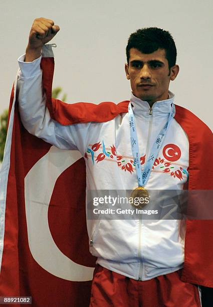 Gold medalist Kerem Gurgen of Turkey stands on the podium during the medal ceremony Men's Feather 57kg final on day 6 during the XVI Mediterranean...
