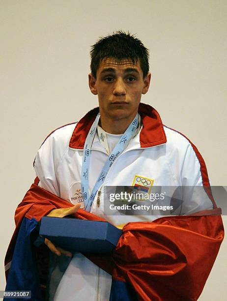 Silver medalist Branimir Stankovic of Serbia stands on the podium during the medal ceremony Men's Feather 57kg final on day 6 during the XVI...