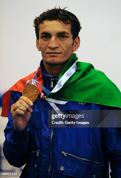 Gold medalist Vittorio Parrinello of Italy stands on the podium during the medal ceremony Men's Bantam 54kg final on day 6 during the XVI...