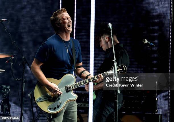Josh Homme of Queens of the Stone Age performs with a bloody face onstage during KROQ Almost Acoustic Christmas 2017 at The Forum on December 9, 2017...