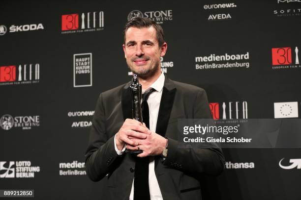 Claes Bang with award during the 30th European Film Awards 2017 at 'Haus der Berliner Festspiele' on December 9, 2017 in Berlin, Germany.