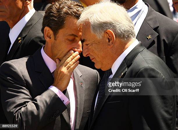 French President Nicolas Sarkozy chats to Dominique Strauss-Kahn, the Head of the IMF, prior to make his way to the stage where the leaders of the G8...
