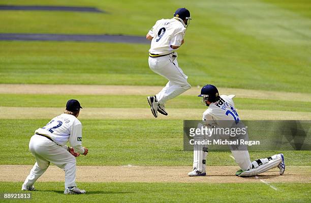 Jonathan Trott of Warwickshire attempts to move out of the way but ends up catching out Ed Joyce of Sussex as the ball goes straight into his pocket...