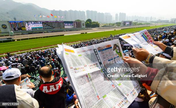 General view of local punters at the track during Longines Hong Kong International Race Day at Sha Tin Racecourse on December 10, 2017 in Hong Kong,...