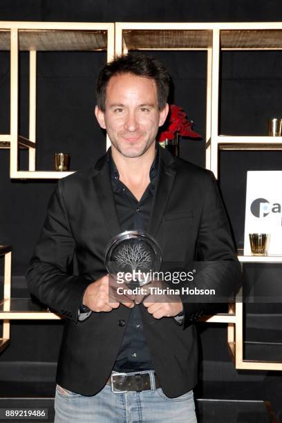 Marcel Mettelsiefen poses with the Pare Lorentz Award at the 33rd Annual IDA Documentary Awards at Paramount Theatre on December 9, 2017 in Los...