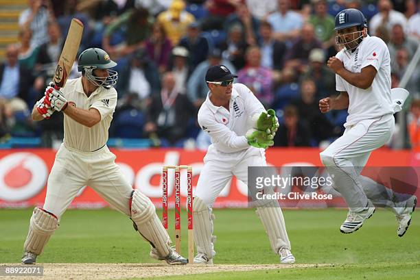 Simon Katich of Australia hits out as Ravi Bopara of England takes evasive action during day two of the npower 1st Ashes Test Match between England...