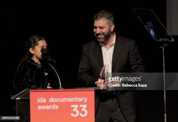 Bana al-Abed and Evgeny Afineevsky accepts an award at the 33rd Annual IDA Documentary Awards at Paramount Theatre on December 9, 2017 in Los...