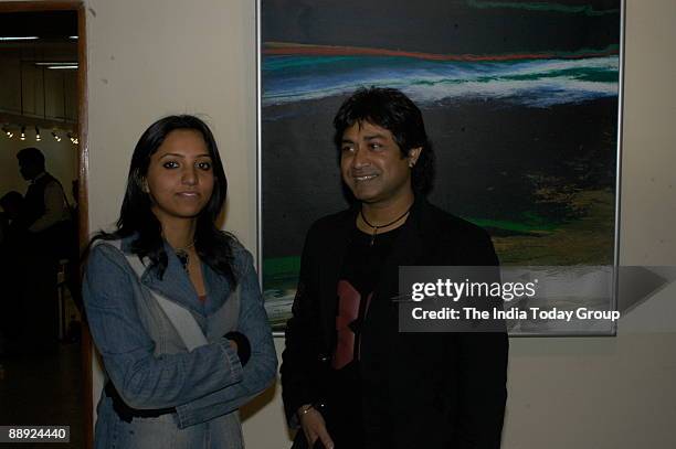 Vinita Dasgupta with artist Niladri Paul at painter Kanwar Singh Panwar's art exhibition at Lalit Kala Academy in New Delhi.