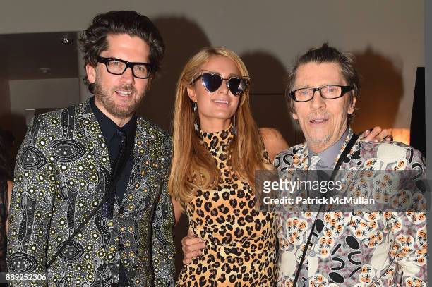 Paul Solberg, Paris Hilton and Christopher Makos attend the Galerie Gmurzynska Dinner in Honor of Jean Pigozzi at the Penthouse at the Faena Hotel...