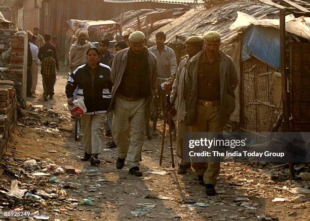 Police personnel are on petrol at Nithari village, Noida, where serial killing took place in which children and women were killed after sexually...