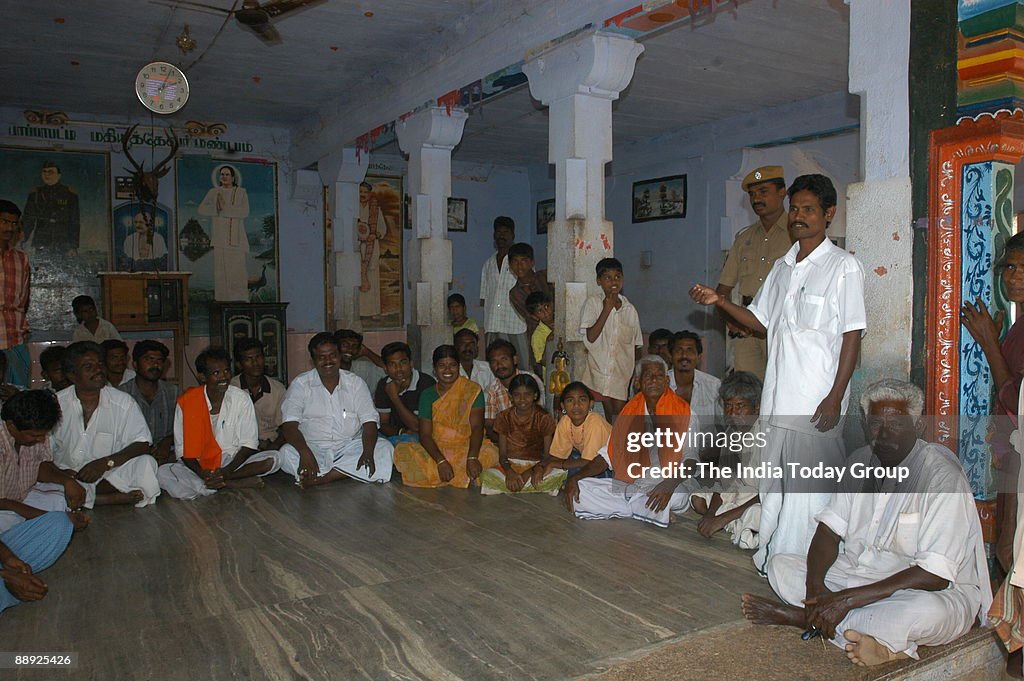 Pandedriappan, Dalit President of Pappapatti Village Panchayat with Police Security Guard, addressing the People for construction work in his Colony in Madurai District, Chennai, Tamil Nadu, India