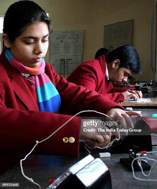 Students doing practical at Physic Lab at Springdales School, Dhaula Kuan, New Delhi.