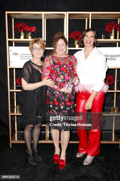 Kirsten Johnson Abigail Disney and Gini Reticker pose with the Amicus Award at the 33rd Annual IDA Documentary Awards at Paramount Theatre on...