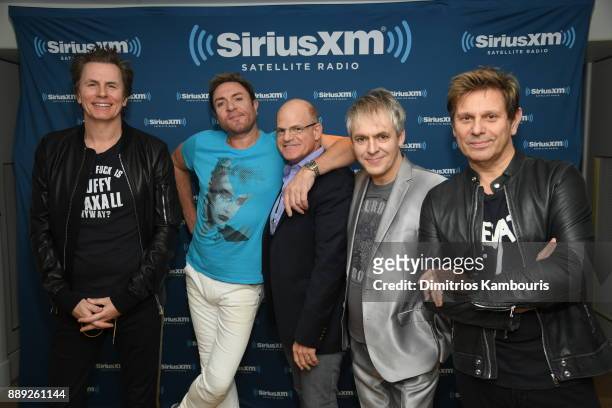Duran Duran and President and Chief Content Officer of SiriusXM Scott Greenstein pose backstage For SiriusXM At The Faena Theater In Miami Beach...