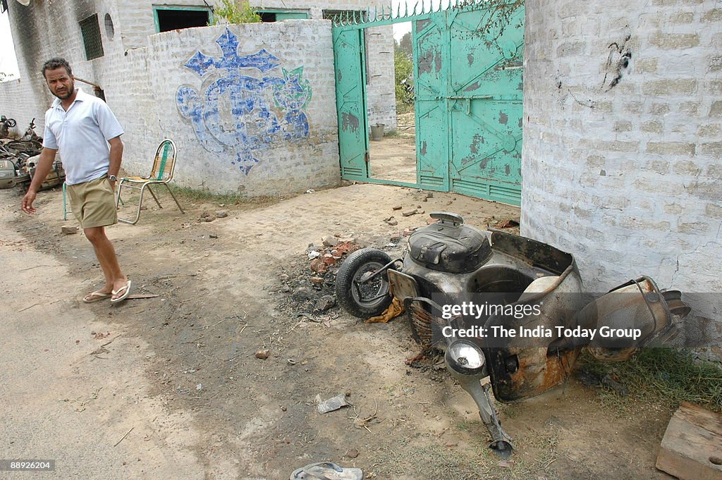 Vehicle damaged by activists and Indian Sikhs brandish swords as they raise slogans against the chief of the religious sect Dera Sacha Sauda (DSS), Gurmeet Ram Rahim Singh. Punjab Police registered a case against Dera head Gurmeet Ram Rahim Singh for alle