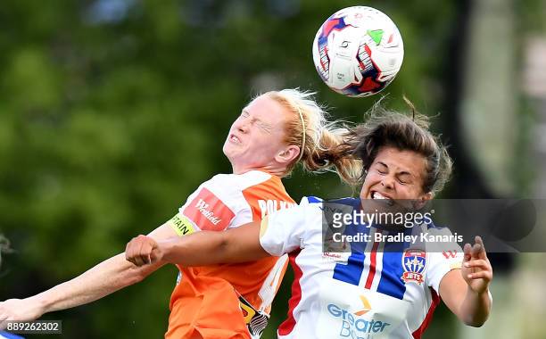 Clare Polkinghorne of the Roar and Katherine Stengel of the Jets challenge for the ball during the round seven W-League match between the Brisbane...