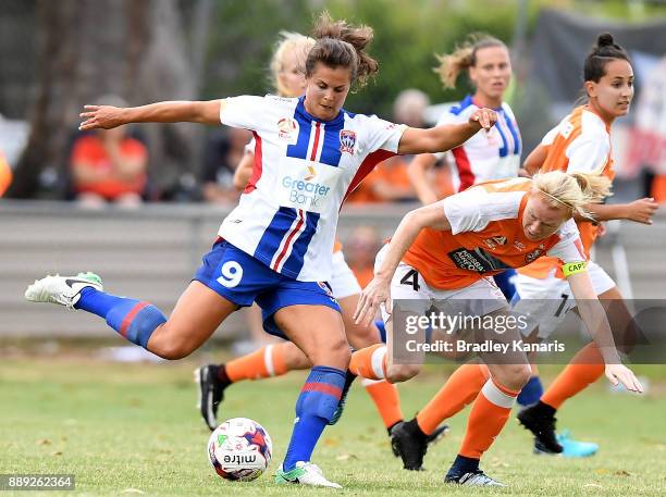 Katherine Stengel of the Jets takes on the defence during the round seven W-League match between the Brisbane Roar and the Newcastle jets at AJ Kelly...