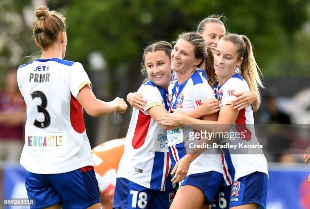 Arin Gilliland of the Jets is congratulated by team mates after scoring a goal during the round seven W-League match between the Brisbane Roar and...