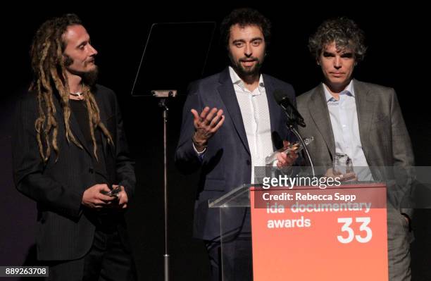 Manuel Pereira, Chico Pereira, and Gabriel Molera accept the Best Writing Award at the 33rd Annual IDA Documentary Awards at Paramount Theatre on...
