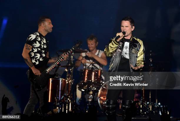 Chris Wolstenholme, Dominic Howard, and Matt Bellamy of Muse perform onstage during KROQ Almost Acoustic Christmas 2017 at The Forum on December 9,...