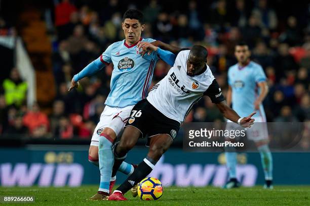 Kondogbia of Valencia CF competes for the ball with Pablo Hernandez of Real Club Celta de Vigo during the La Liga game between Valencia CF and Real...