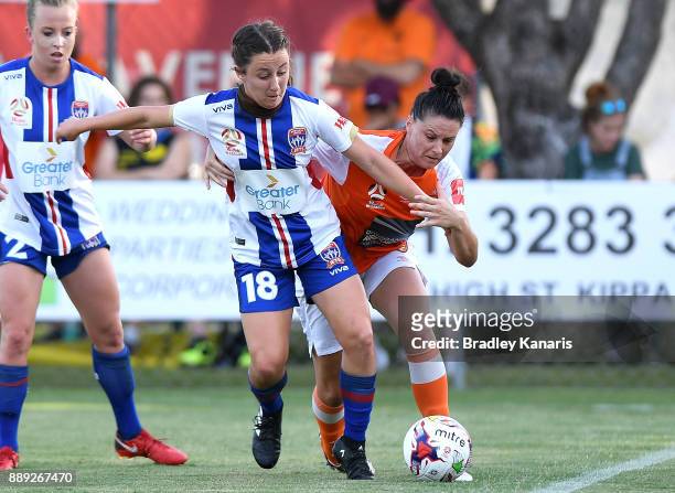 Clare Wheeler of the Jets and Emily Gielnik of the Roar compete for the ball during the round seven W-League match between the Brisbane Roar and the...