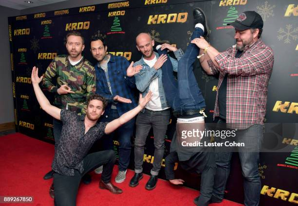 Tim McIlrath, Mike Kerr, Joe Principe, Zach Blair, Ben Thatcher and Brandon Barne of Rise Against and Royal Blood pose in the press room at KROQ...