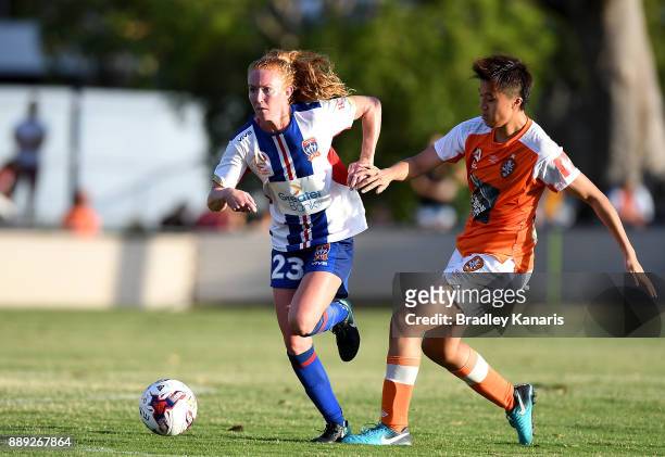 Victoria Huster of the Jets breaks away from the defence of Wai Ki Cheung of the Roar during the round seven W-League match between the Brisbane Roar...