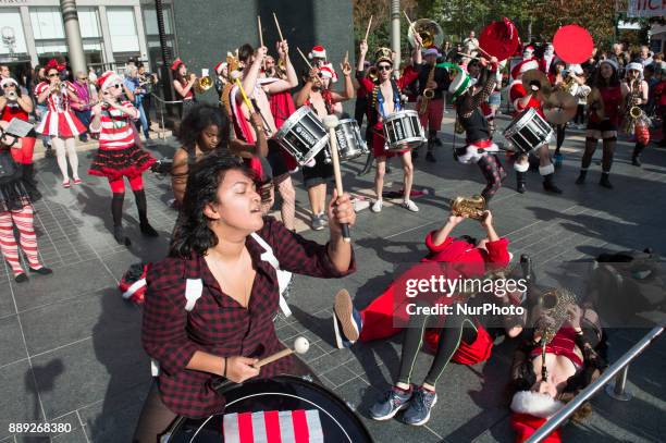 Thousands of people dressed up in Santa Claus costume gather at Union Square in San Francisco, California to celebrate SantaCon before Christmas on...