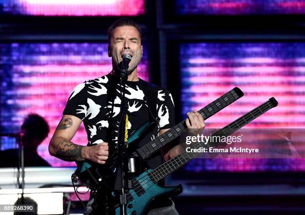 Chris Wolstenholme of Muse performs onstage during KROQ Almost Acoustic Christmas 2017 at The Forum on December 9, 2017 in Inglewood, California.