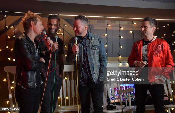 Ted Stryker interviews Dominic Howard, Chris Wolstenholme and Matt Bellamy of Muse performs onstage during KROQ Almost Acoustic Christmas 2017 at The...