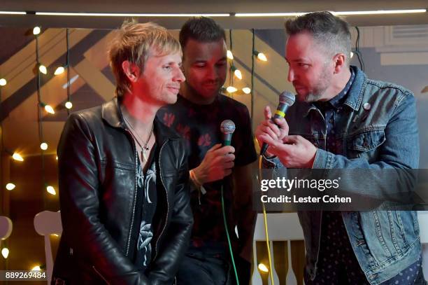 Ted Stryker interviews Dominic Howard and Chris Wolstenholme of Muse performs onstage during KROQ Almost Acoustic Christmas 2017 at The Forum on...