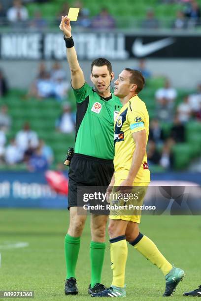 Alan Baro Calabuig of Central Coast Mariners is shown a yellow card during the round 10 A-League match between Melbourne City FC and the Central...