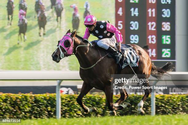 Jockey Derek K C Leung riding Beauty Generation wins the Longines Hong Kong Mile during the Longines Hong Kong International Races at Sha Tin...