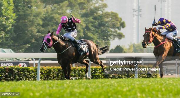 Jockey Derek K C Leung riding Beauty Generation wins the Longines Hong Kong Mile during the Longines Hong Kong International Races at Sha Tin...