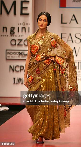 Model is walking on the ramp with Agnimitra Paul outfit at Lakme India Fashion Week-2007 in Mumbai, Maharashtra, India