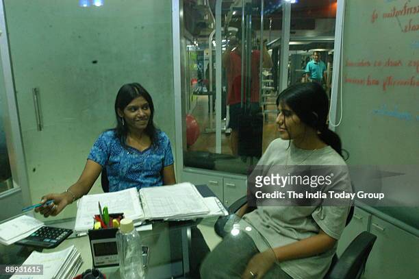 Ashwini, The Dietician of Blue Boutique Gym with her client at the Gymnasium in Chennai, Tamil Nadu, India