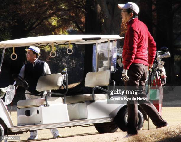 Japanese Prime Minister Shinzo Abe and Japan Association of Corporate Executives Chairman Yoshimitsu Kobayashi play golf in Chigasaki, Kanagawa...