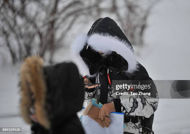 Candidates walk to an exam site before China's national civil servant exam on December 10, 2017 in Harbin,Heilongjiang province of China....