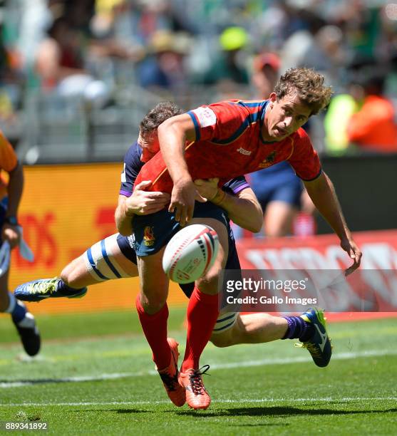 Manuel Sainz-Trapaga of Spain tackled by Scott Riddell of Scotland during day 2 of the 2017 HSBC Cape Town Sevens match between Scotland and Spain at...