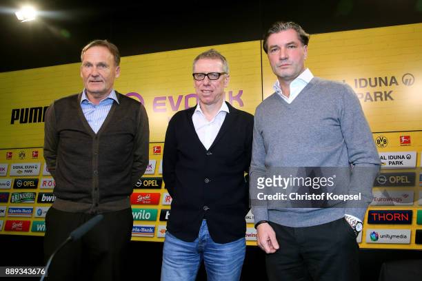 Hans Joachim Watzke, chairman of the board and manager Michael Zorc present Peter Stoeger as the new head coach during the press conference at Signal...