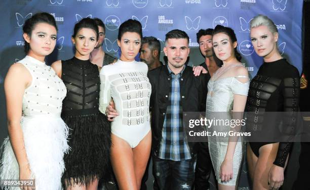 Natalie Mejia, Lauren Umansky, Chelsea Publico, Erik Rosete, Kaidan Darney and Kiera Smith pose for a photo with models wearing the Mister Triple X...