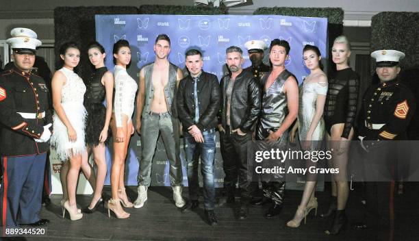 Natalie Mejia, Lauren Umansky, Chelsea Publico, Erik Rosete, Kaidan Darney and Kiera Smith pose for a photo with models wearing the Mister Triple X...