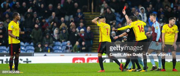 Referee Lee Probert shows Watford's Marvin Zeegelaar the red card for a foul on Burnley's Steven Defour during the Premier League match between...