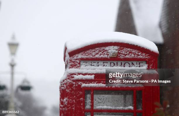 Snow covered phone box in Marlow, Buckinghamshire, as heavy snowfall across parts of the UK is causing widespread disruption, closing roads and...