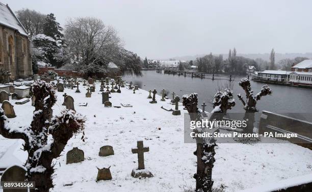 Snow covered grave yard in Marlow, Buckinghamshire, as heavy snowfall across parts of the UK is causing widespread disruption, closing roads and...
