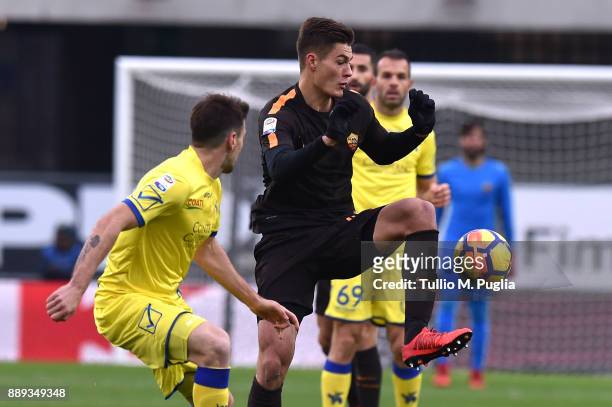 Patrick Schick of Roma controls the ball as Nenan Tomovic of Chievo Verona tackles during the Serie A match between AC Chievo Verona and AS Roma at...