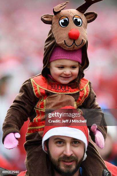 Over eight thousand members of the public take part in Glasgow's annual Santa dash make their way along St Vincent Street on December 10, 2017 in...